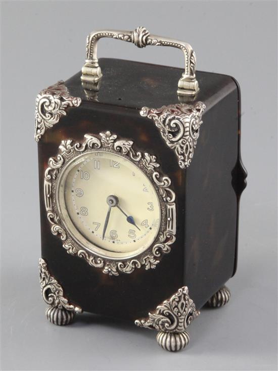 A George V silver mounted tortoiseshell carriage clock, height 12.5cm.